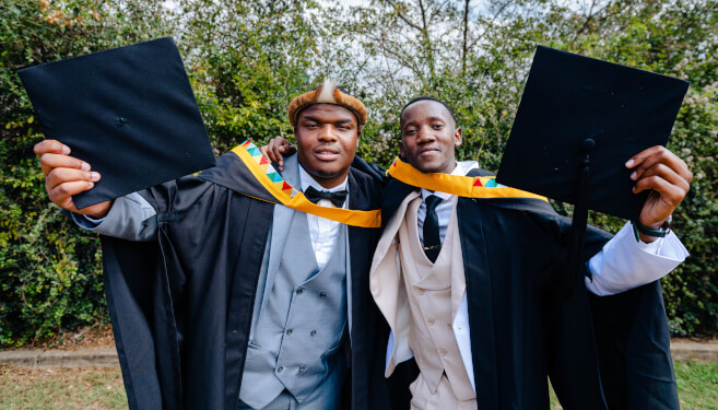 Master’s in Finance cum laude graduates, Mr Lungelo Madondo and Mr Philani Nxele.